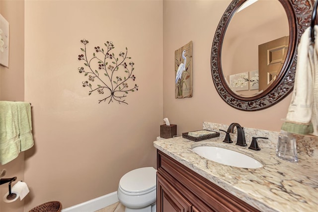 bathroom featuring toilet and vanity