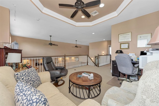 home office with crown molding, light carpet, and a tray ceiling