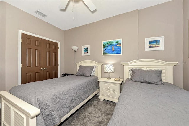 carpeted bedroom with a closet and ceiling fan