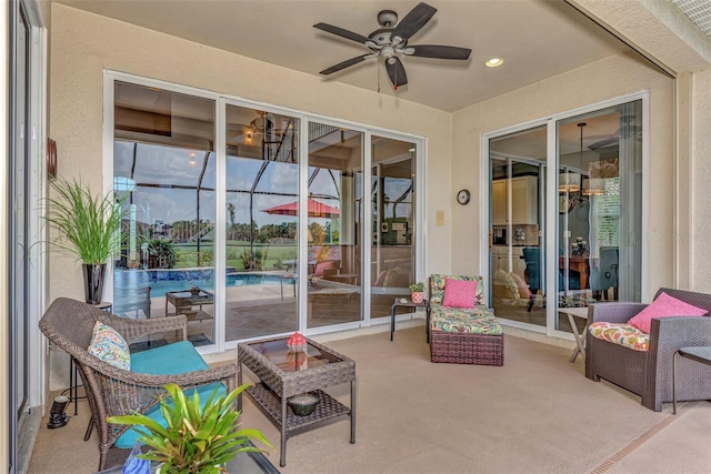 view of patio with a lanai and ceiling fan