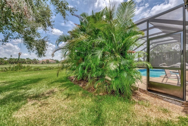 view of yard with a lanai