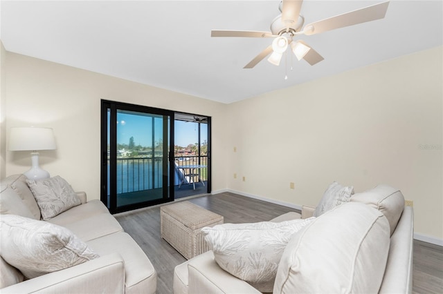 living room with hardwood / wood-style floors and ceiling fan