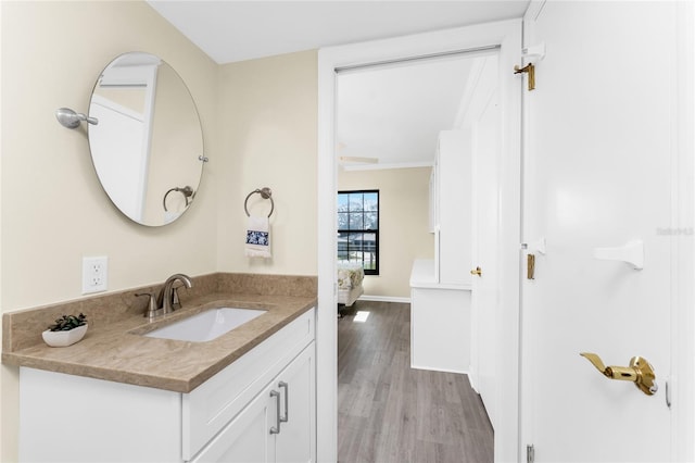 bathroom with vanity and hardwood / wood-style floors