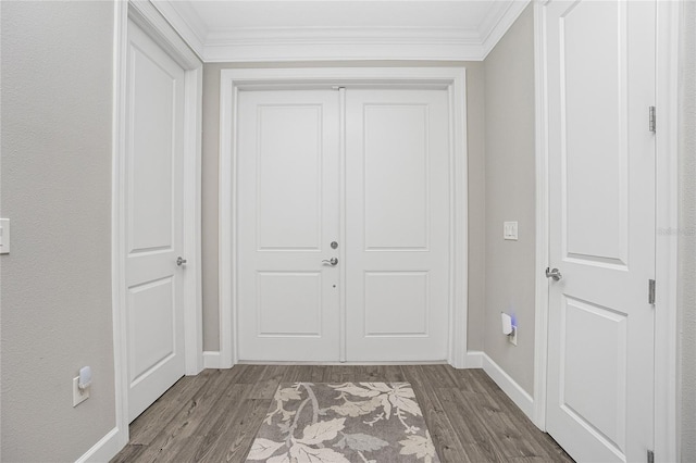 interior space with wood-type flooring and ornamental molding