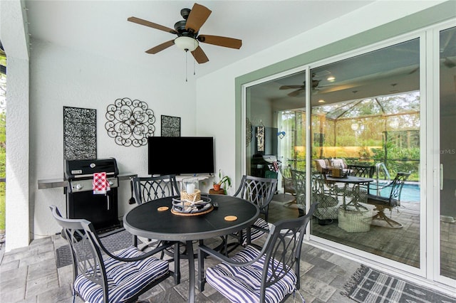 interior space with ceiling fan