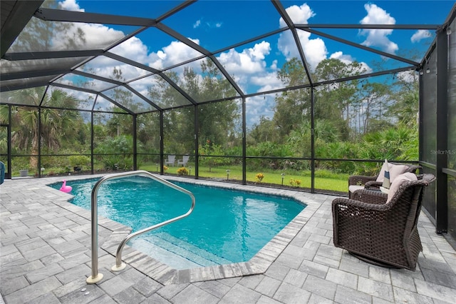 view of swimming pool featuring a patio area and glass enclosure