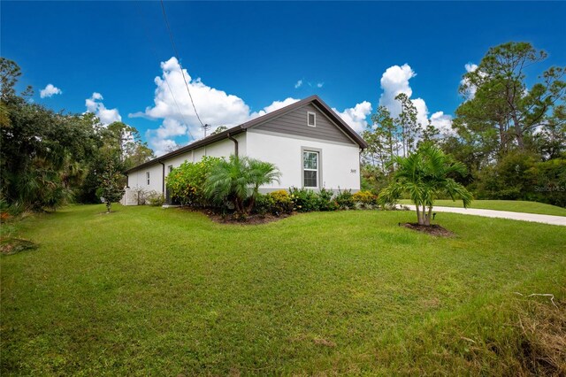 view of home's exterior with a yard