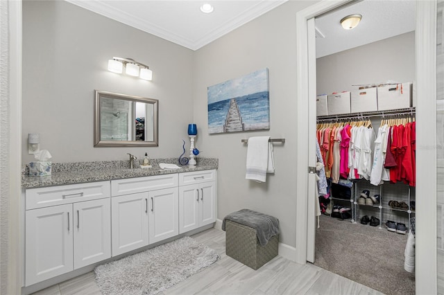 bathroom featuring vanity and crown molding