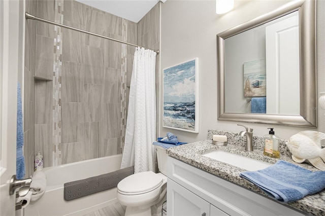 full bathroom with vanity, toilet, and shower / tub combo