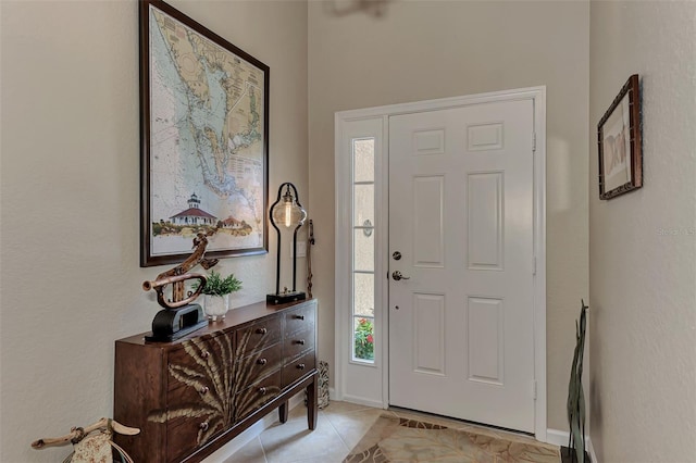 entrance foyer featuring plenty of natural light and light tile patterned floors