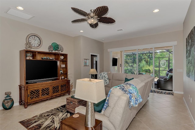 living room featuring ceiling fan and light tile patterned flooring