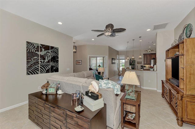 living area with ceiling fan, recessed lighting, baseboards, light tile patterned floors, and visible vents