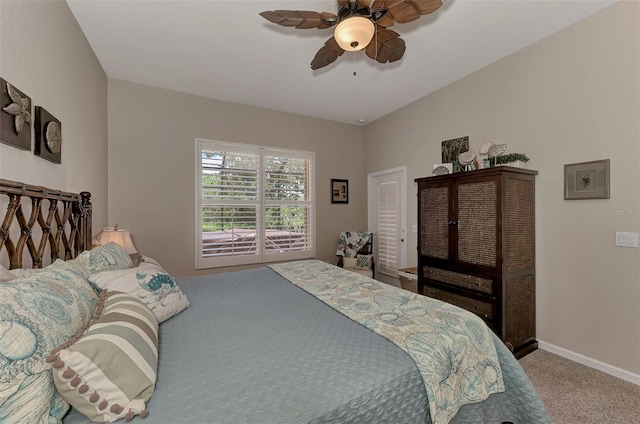 carpeted bedroom featuring baseboards and ceiling fan