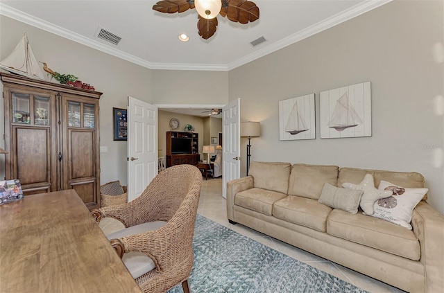 tiled living room with ornamental molding and ceiling fan