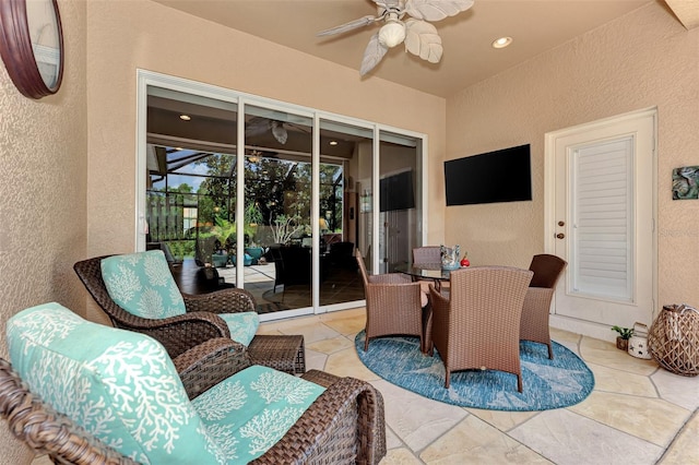 view of patio featuring outdoor dining area and ceiling fan
