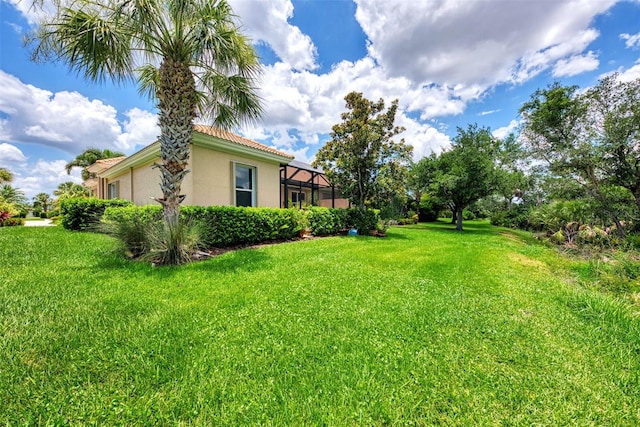 view of yard featuring a lanai