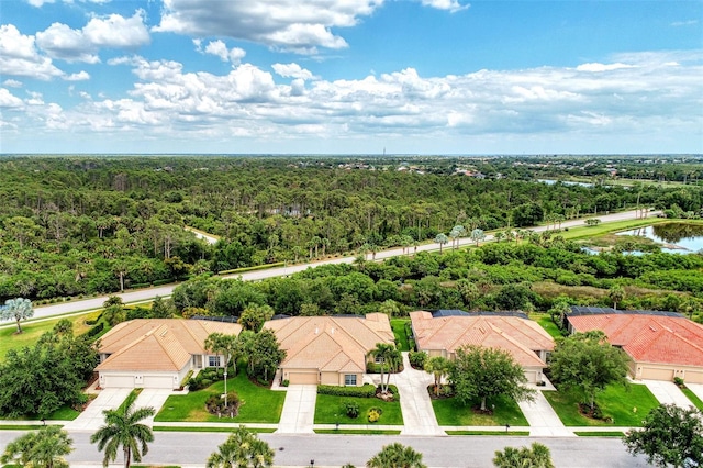bird's eye view featuring a water view and a forest view