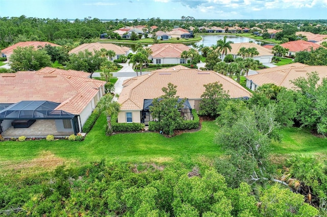 bird's eye view featuring a water view and a residential view