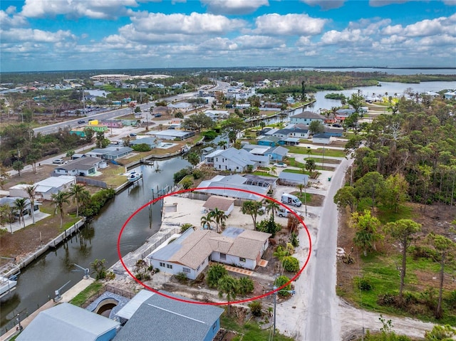 bird's eye view with a water view