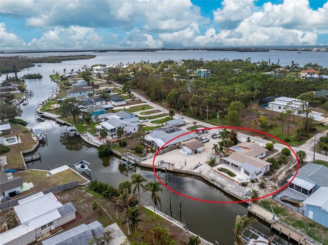 drone / aerial view with a water view