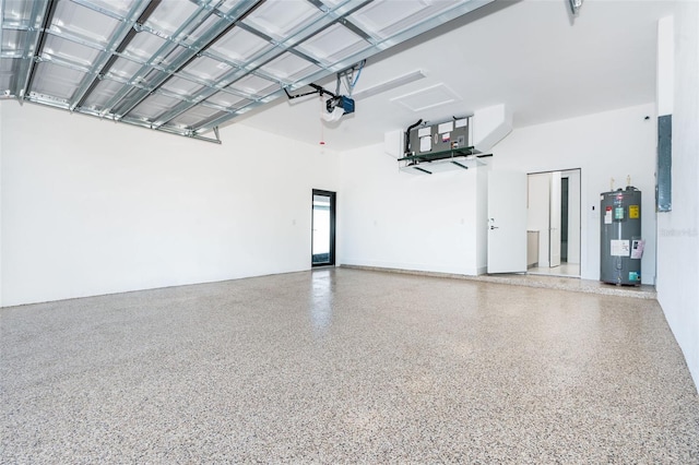 garage with a garage door opener and electric water heater