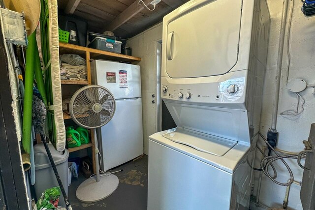 washroom with stacked washer / drying machine