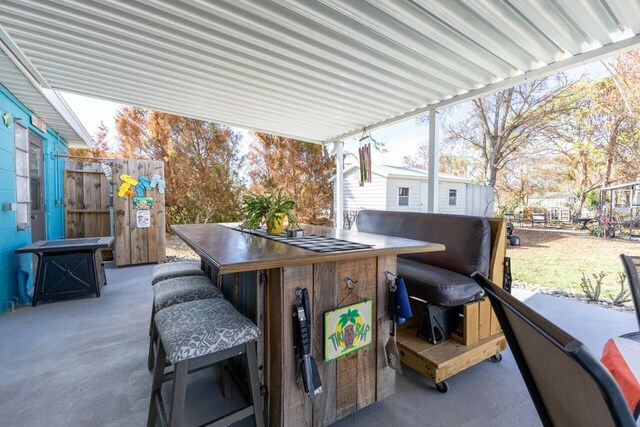 view of patio with a bar