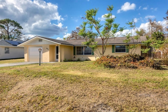 ranch-style house with a garage and a front yard