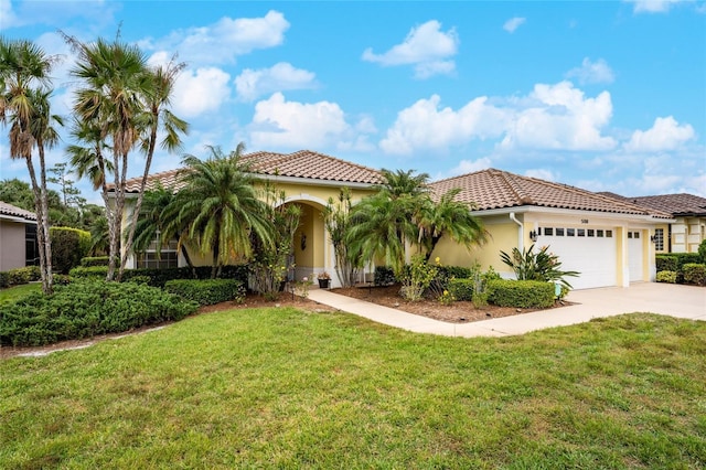 mediterranean / spanish-style house with a front lawn and a garage