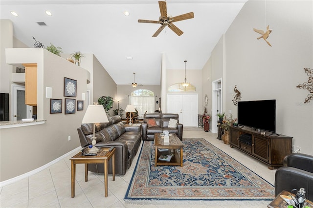 tiled living room featuring high vaulted ceiling and ceiling fan