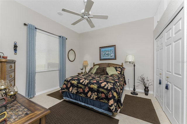 tiled bedroom with a closet and ceiling fan