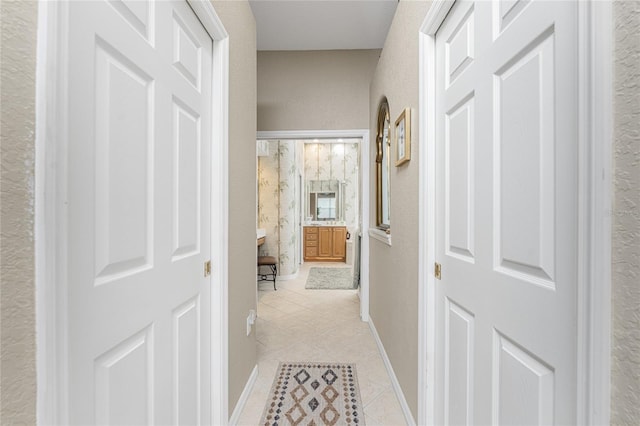 hall featuring light tile patterned flooring