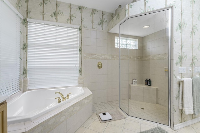 bathroom featuring independent shower and bath and tile patterned flooring