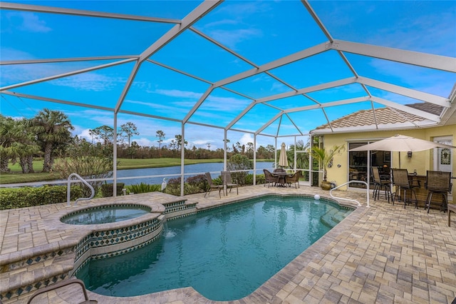 view of swimming pool with a patio area, a lanai, an in ground hot tub, and a water view