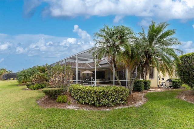 view of yard featuring a lanai