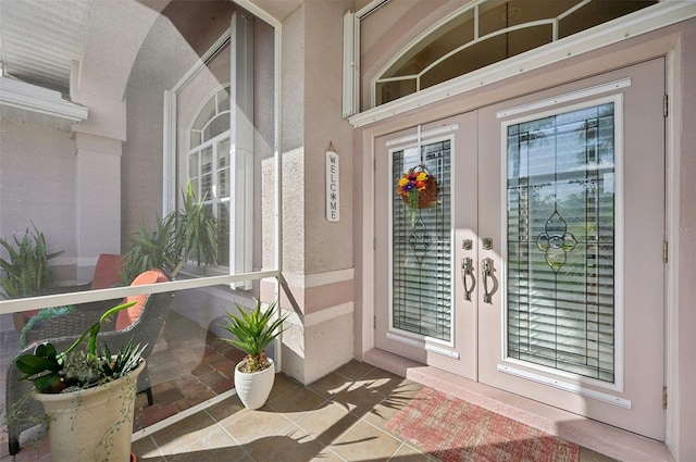 view of exterior entry featuring french doors