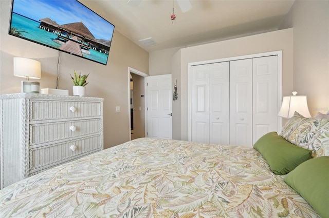 bedroom with ceiling fan and a closet