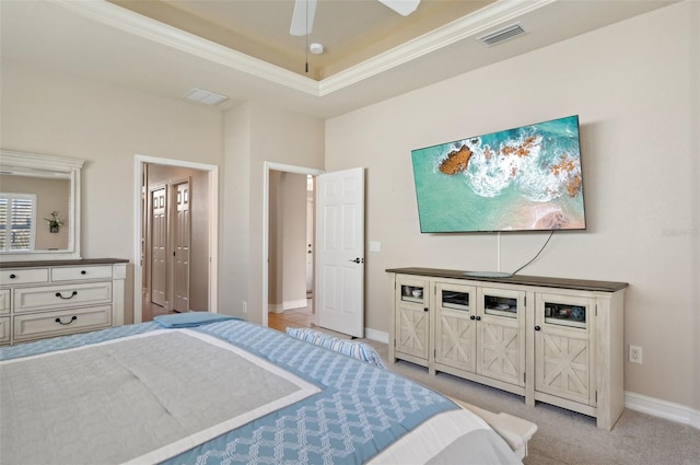 carpeted bedroom featuring ceiling fan and ornamental molding