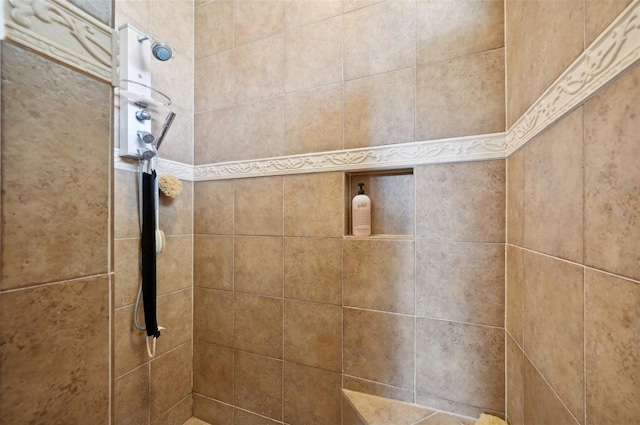 bathroom with tiled shower