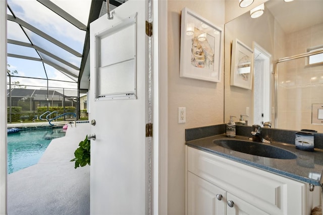 bathroom with vanity, walk in shower, and vaulted ceiling