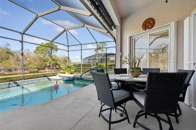 view of pool featuring glass enclosure and a patio area