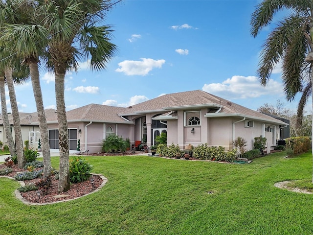 ranch-style house with a front lawn