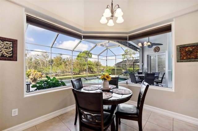 tiled dining room featuring an inviting chandelier