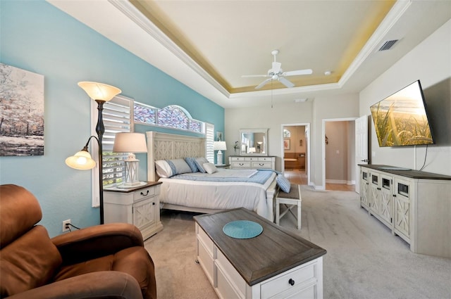 bedroom featuring light colored carpet, a raised ceiling, ceiling fan, and ornamental molding