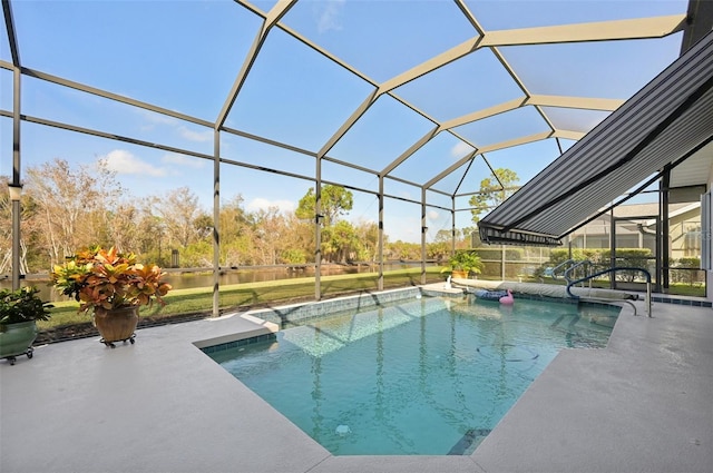 view of pool with glass enclosure and a patio