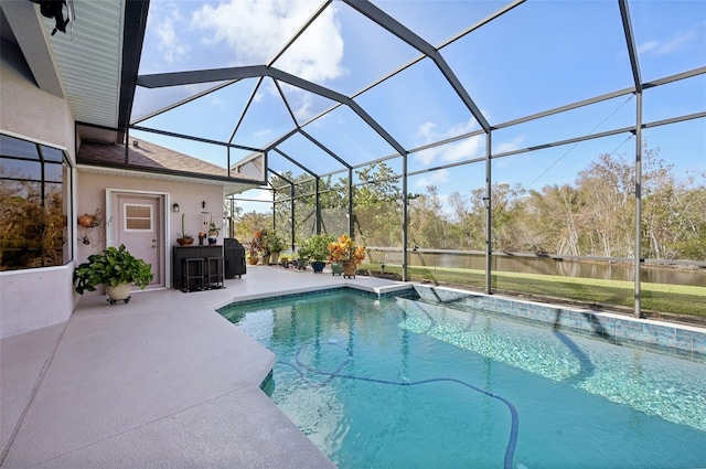 view of swimming pool with glass enclosure, an outdoor bar, and a patio