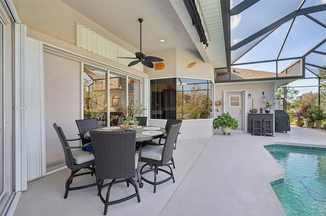 exterior space with ceiling fan and a swimming pool