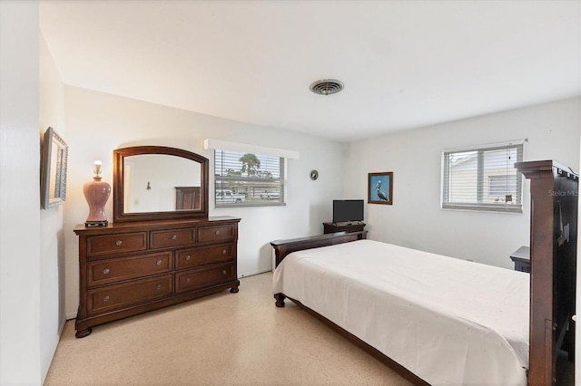 bedroom with multiple windows