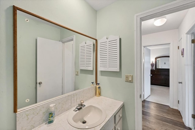 bathroom featuring vanity and hardwood / wood-style floors