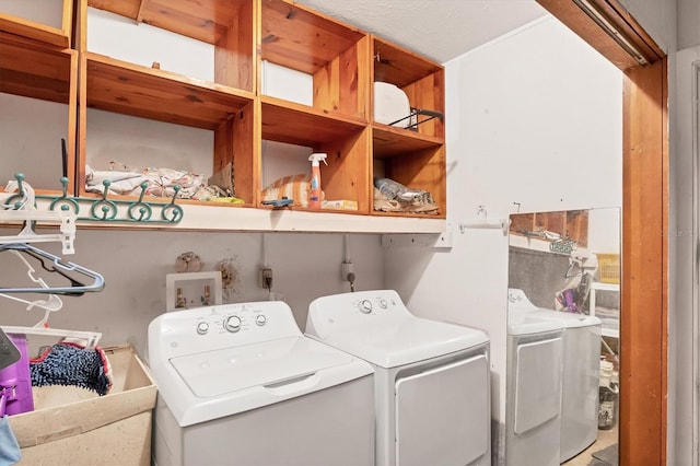 laundry area with sink and separate washer and dryer